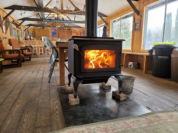 New Fireplace with wood         ablaze.